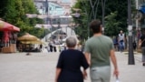 KOSOVO: Citizens walking in North Mitrovica, next to bridge crossing the Ibar river in Mitrovica, Kosovo, connecting South Mitrovica and North Mitrovica. 