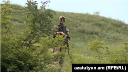 An armed soldier is seen near Kirants village in northern Armenia on May 23.