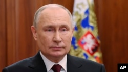 Vladimir Putin u Kremlju gdje se, putem video linka, obratio javnosti povodom Dana pripadnika službe bezbjednosti, Moskva, 20. decembra 2023.