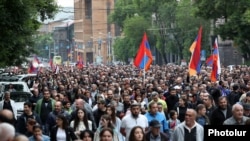 Anti-government protesters march through Yerevan on May 26.