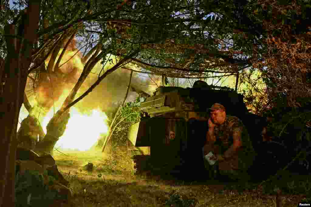 A Ukrainian artillerist fires a self-propelled howitzer toward Russian troops near the town of Chasiv Yar in the Donetsk region.