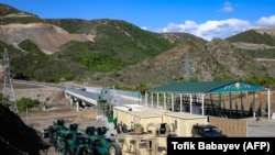 A view of an Azerbaijani checkpoint set up at the entry of the Lachin corridor, Nagorno-Karabakh's only land link with Armenia, by a bridge across the Hakari river on May 2, 2023. 