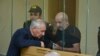 Vagif Khachatrian (right) attends a military court in Baku on October 13. 