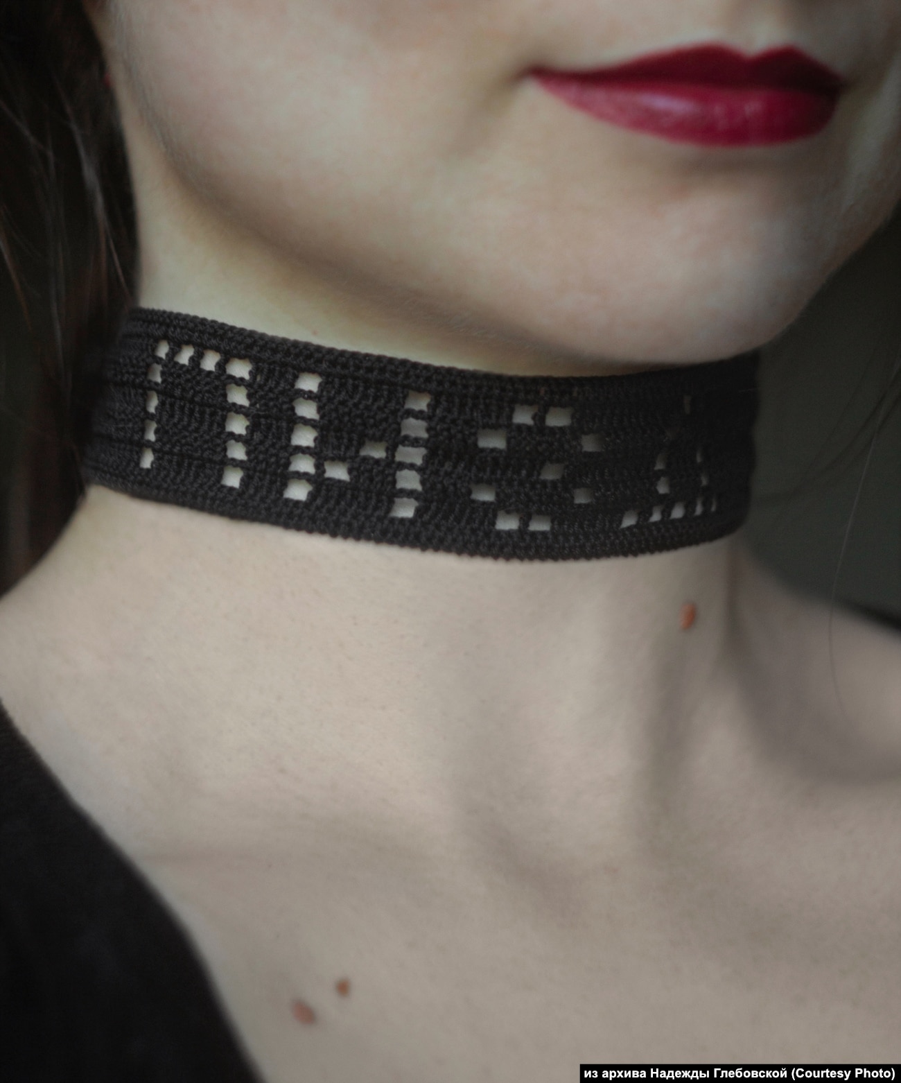 A choker with a Russian swear word that can be roughly translated as "screwed."