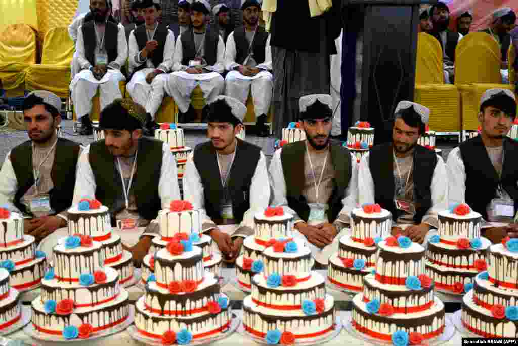 Afghan grooms attend a mass wedding ceremony in Kandahar.