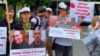 Missing Ukrainian Soldiers' Wives, Children Rally In Switzerland