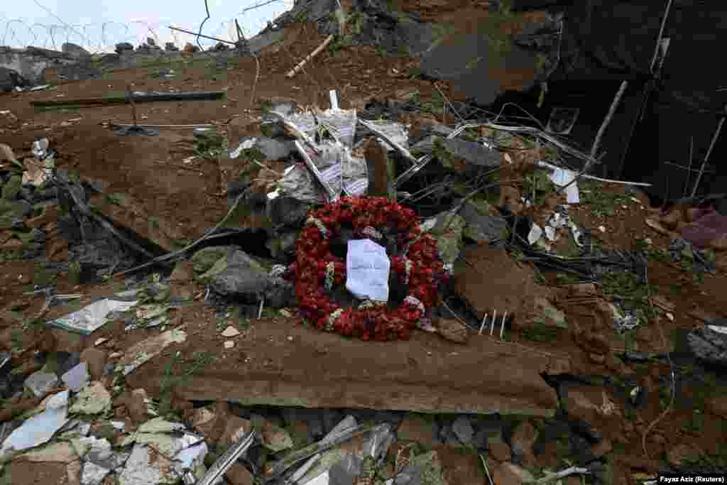 A wreath and flowers sit atop the rubble of the January 30 suicide bombing. A TTP spokesman said, &ldquo;The police have been told many times not to obstruct our way, and instead of paying heed to this, the police have started martyring our comrades,&rdquo; he said. &ldquo;This is why we are targeting them.&rdquo;