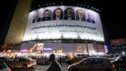 Рекламный щит с лицами шести кандидатов, участвующих в досрочных президентских выборах в Иране, на площади Валиаср в центре Тегерана. Два кандидата прямо перед выборами от участия в них отказались. Мохаммад-Багер Галибаф – крайний слева. 17 июня 2024 года