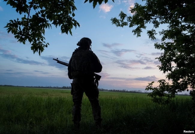 A soldier with Ukraine's 92nd Separate Assault Brigade patrols near the town of Vovchansk.