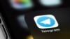 Telegram mobile icon app on screen smartphone iPhone macro. Telegram - cross-platform messenger. Moscow, Russia - June 15, 2021