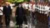 Cuban President Miguel Diaz-Canel (left) and Iranian President Ebrahim Raisi review an honor guard during a welcoming ceremony in Havana on June 15.