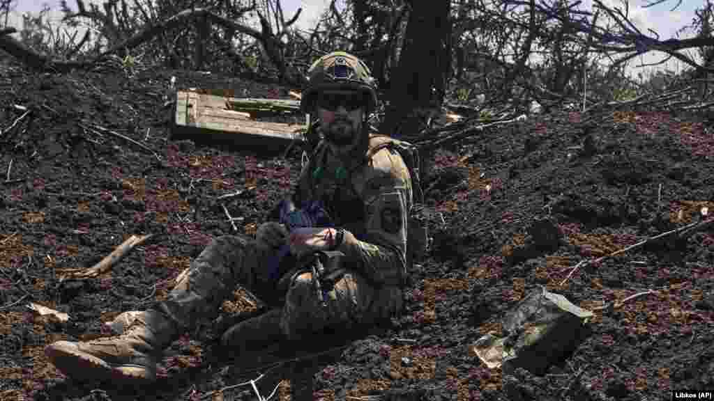 A soldier keeps watch from a trench that was formerly held by Moscow&#39;s forces. &nbsp; The commander of Ukraine&#39;s ground forces, General Oleksandr Syrskiy, said that Russian units were attempting counterattacks to recover the ground they had recently lost to advancing Ukrainian forces.&nbsp; &ldquo;The Bakhmut front has become an arena of active hostilities again.... The enemy is desperately clinging to positions and strongholds that were formerly occupied by Wagner Group fighters.&hellip; Events unfold and change very rapidly, with some positions changing hands twice a day,&rdquo; Syrskiy said, in comments reported by the&nbsp;Ukrainska Pravda&nbsp;magazine.