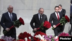 Armenia - Prime Minister Nikol Pashinian (center) lays flowers at the Armenian Genocide Memorial in Yerevan, April 24, 2024.