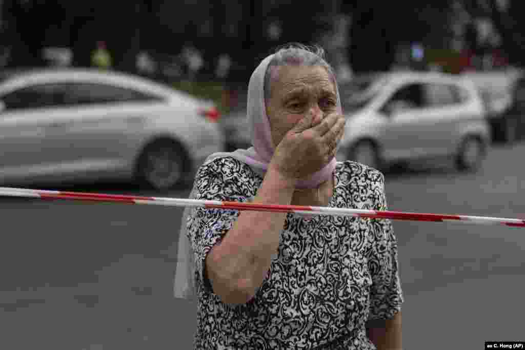 A woman reacts as she stands outside an Orthodox cathedral in Odesa after it was damaged during Russian missile attacks on the Ukrainian port city.&nbsp;&nbsp;