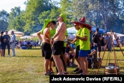 One of the competing teams takes a break from preparing their goulash.