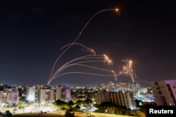 Israel's Iron Dome antimissile system intercepts rockets launched from the Gaza Strip on October 8, 2023.