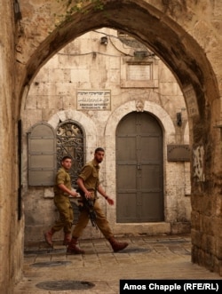 Israeli soldiers walk down Armenian Orthodox Patriarchate Road, in Jerusalem's Armenian Quarter, on June 13.