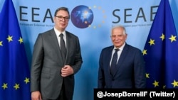 EU foreign policy chief Josep Borrell (right) with Serbian President Aleksandar Vucic in Brussels on June 22.