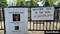 Relatives of Shahab Dalili protested outside the White House on August 13 with signs calling for his release. 
