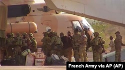 Russian mercenaries boarding a helicopter in northern Mali.