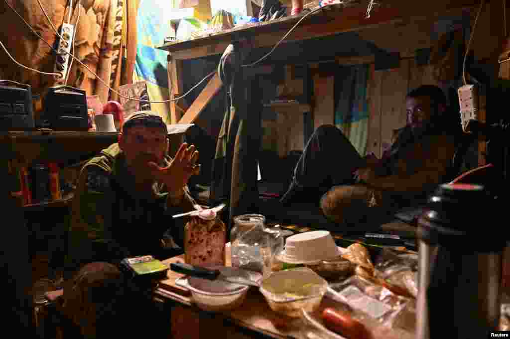 Ukrainian soldiers rest in their dugout near the front line. Since the start of their counteroffensive, Ukrainian forces have been engaged in offensive operations in the area of Bakhmut, a city captured earlier this year by Russian forces after months of some of the bloodiest fighting in the war.