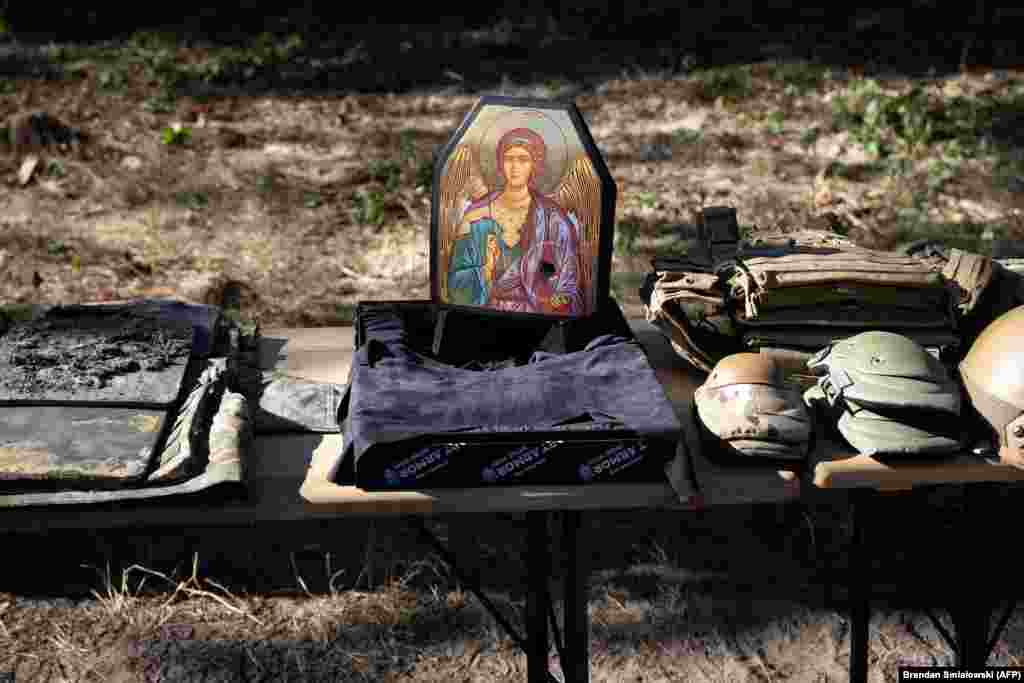 A spent chest plate is seen with other damaged body armor at a Ukrainian border guard supply site in the Kyiv region.