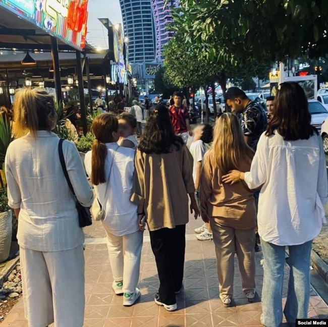 Women defying the mandatory hijab in Iran.