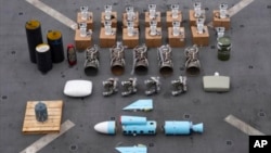 Photograph released by the U.S. military's Central Command show what are described as Iranian-made missile components bound for Yemen's Huthi rebels after the seizure of a vessel in the Arabian Sea. (file photo)