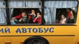 Children are evacuated from the Russian-occupied town of Kupyansk town on the outskirts of Kharkiv in May 2022.