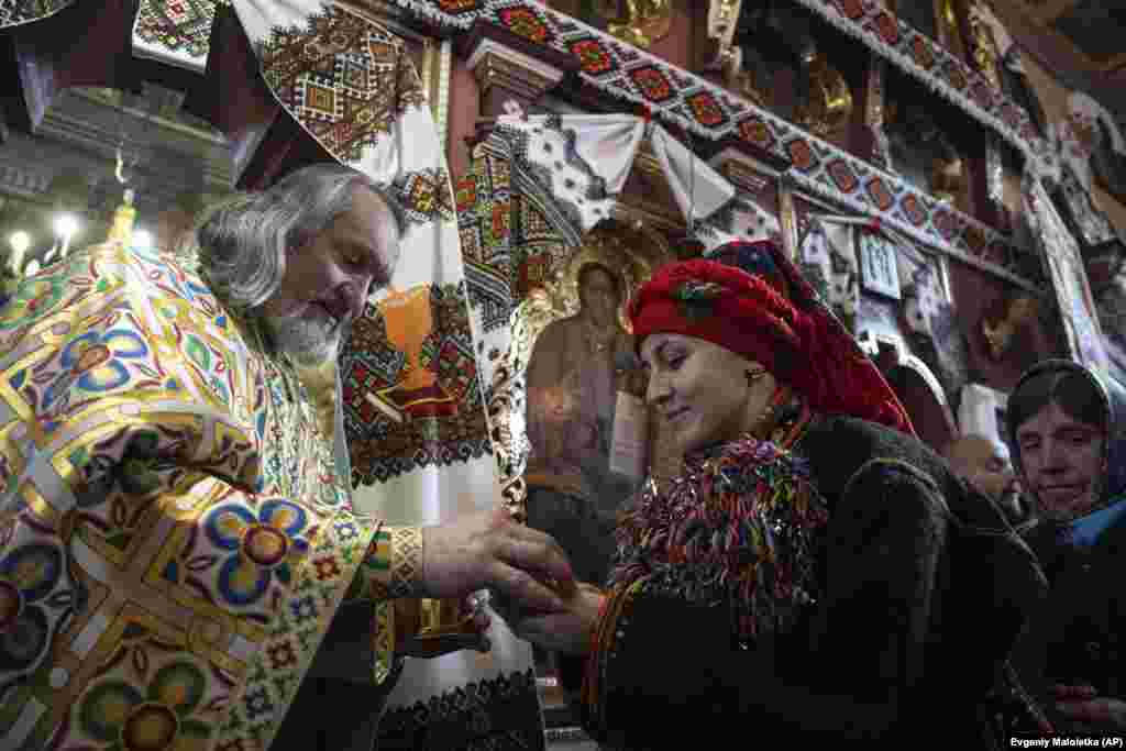 ...before receiving a blessing from the village&nbsp;Priest Ivan Rybaruk.