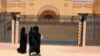 Women walk past the Iranian embassy in Riyadh, which will reopen on June 6. (file photo)