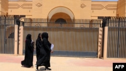 Women walk past the Iranian embassy in Riyadh, which will reopen on June 6. (file photo)