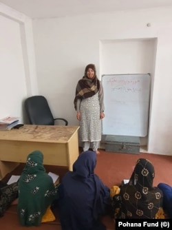 Students and their teacher inside a secret school in southern Afghanistan.