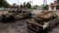 Cars destroyed by an apparent Russian cluster-munitions strike on the Ukrainian town of Lyman on July 8. 