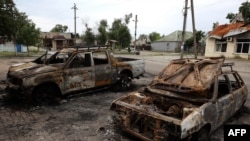 Автомобили, уничтоженные российскими ракетными ударами, город Лиман в Донецкой области Украины, 8 июля 2023 года