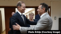 Serbian Deputy Prime Minister Aleksandar Vulin (right) and Russian Deputy Prime Minister Denis Manturov meet in Moscow on August 15.