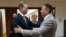 Serbian Deputy Prime Minister Aleksandar Vulin (right) and Russian Deputy Prime Minister Denis Manturov meet in Moscow on August 15.