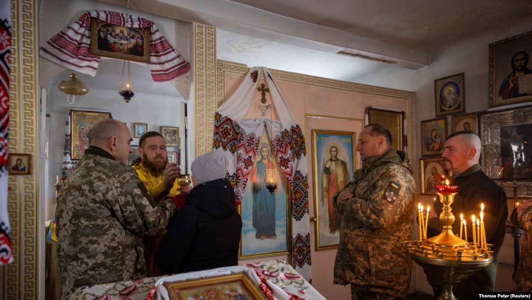 Ukrainian soldiers attend Mass at an Orthodox church near the front lines in the Donetsk region as Ukrainians prepare to celebrate their first Christmas according to a Western calendar.
