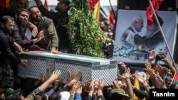 Iranians attend the funeral procession of assassinated Hamas chief Ismail Haniyeh in Tehran on August 1.