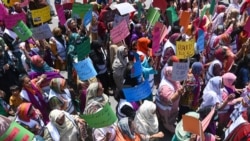 Female Pakistani workers march along a street to mark International Labor Day in Lahore.