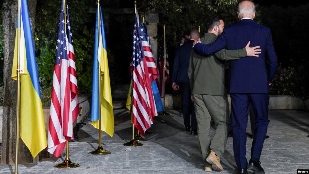 U.S President Joe Biden (right) walks with Ukrainian President Volodymyr Zelenskiy after a bilateral meeting on the sidelines of the G7 summit in Fasano, Italy, on June 13.