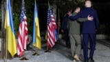 U.S President Joe Biden (right) walks with Ukrainian President Volodymyr Zelenskiy after a bilateral meeting on the sidelines of the G7 summit in Fasano, Italy, on June 13.