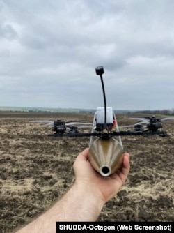 A photo on SHUBBA-Octagon's website shows a DJI drone armed with an explosive.