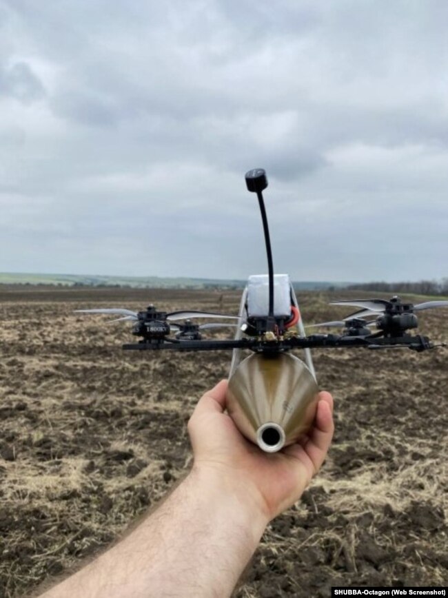 A photo on SHUBBA-Octagon's website shows a DJI drone armed with an explosive.