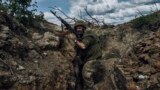 A Ukrainian soldier engages Moscow&#39;s forces from his trench position near Bakhmut in the Donetsk region on May 22. Fighting for control of the city has continued despite claims by Russia that it has <strong><a href="https://www.rferl.org/a/ukraine-bakhmut-zaporizhzhya-nuclear-plant/32422157.html" target="_blank">fallen to the Kremlin&#39;s troops</a></strong>.<br />
<br />
&nbsp;
