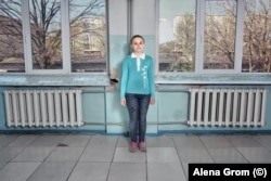 A young student stands in the corridors of a school in Maryinka in 2017.