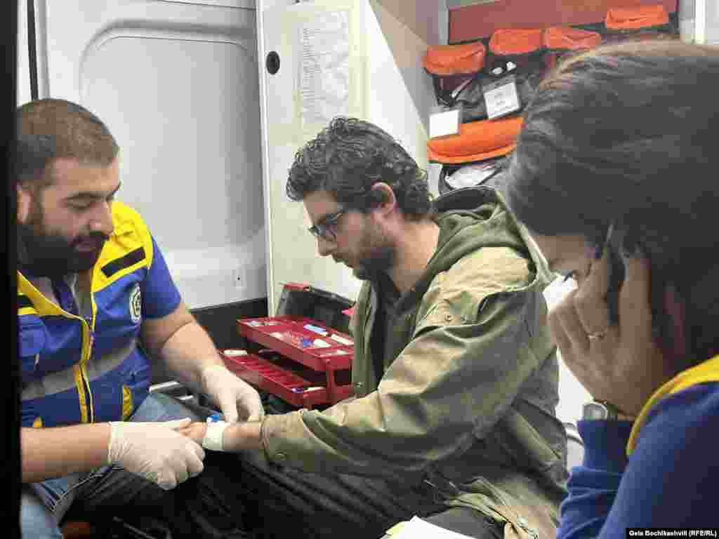 An injured protester receives first aid inside an ambulance during the May 2-3 protests. During the clashes on May 1, at least eight people said they were struck by rubber bullets. RFE/RL gathered eyewitness accounts, photographic evidence of injuries, interviewed two of the injured, and filmed rubber bullets at the scene where they were reportedly fired.