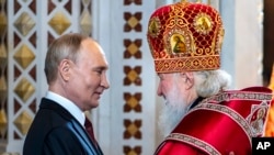 Patriarch Kirill (right), the head of the Russian Orthodox Church, has embraced the Kremlin's war on Ukraine, depicting it as a "holy war." 