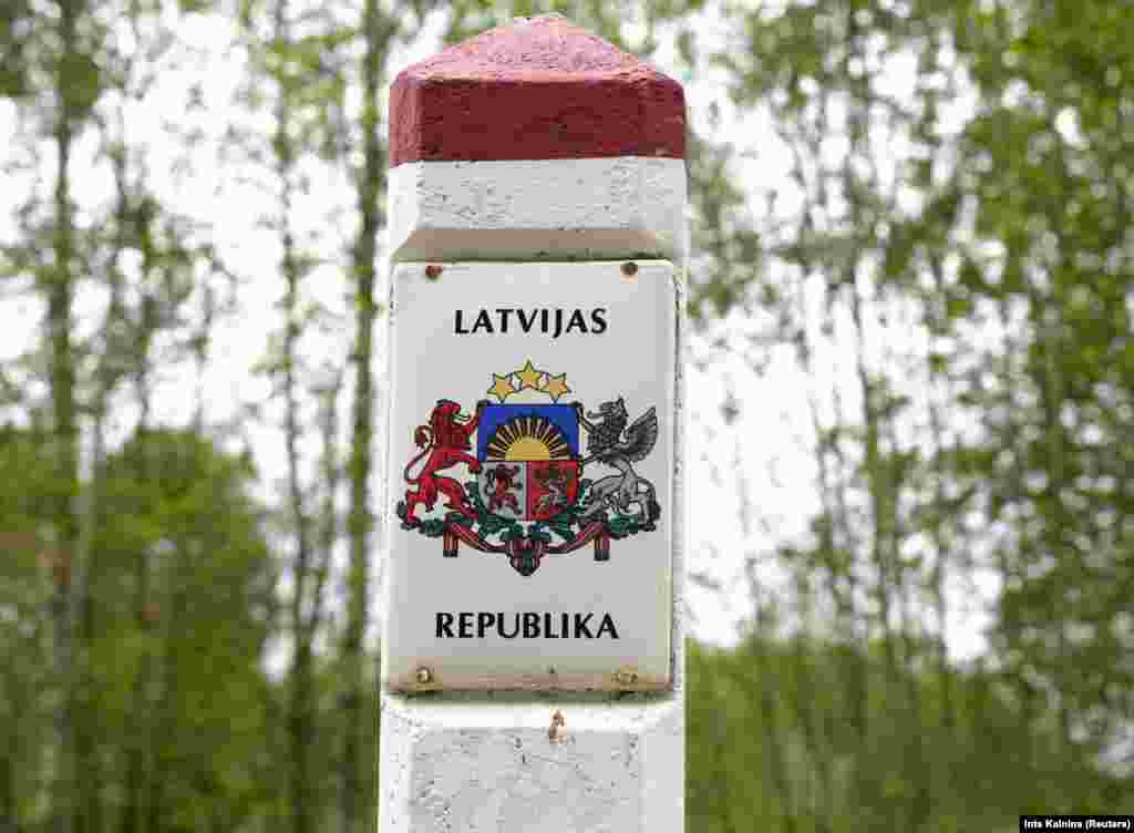 A Latvian border sign is seen at the Latvia-Belarus border near Robeznieki. The border between both countries is almost 173 kilometers long. Latvia also shares a border with Russia to its east. &nbsp;