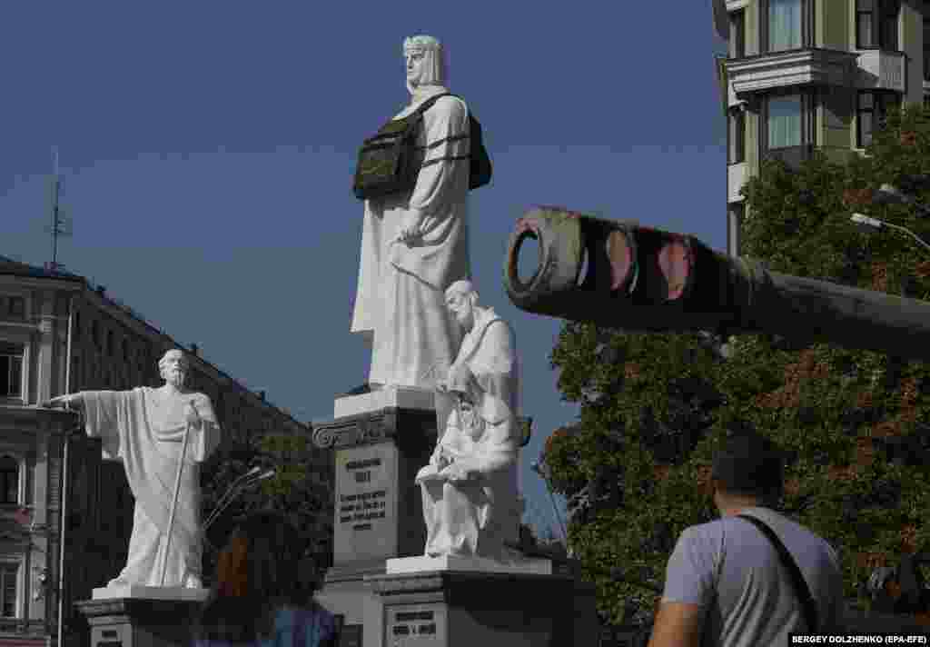 A giant mock bulletproof vest is placed on the monument to Princess Olga next to an exhibition of destroyed Russian military machinery in Kyiv. Unidentified people put the bulletproof vest on the statue with the inscription: &quot;She needs armor.&quot; In March 2022, sandbags were placed around the monument in order to protect it from possible shelling.